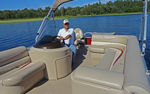 image of bennington pontoon rental at the helm